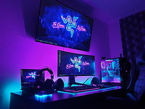 Razer Neon Gaming Battlestation with RGB PC Build and Triple Monitor Array HD wallpaper