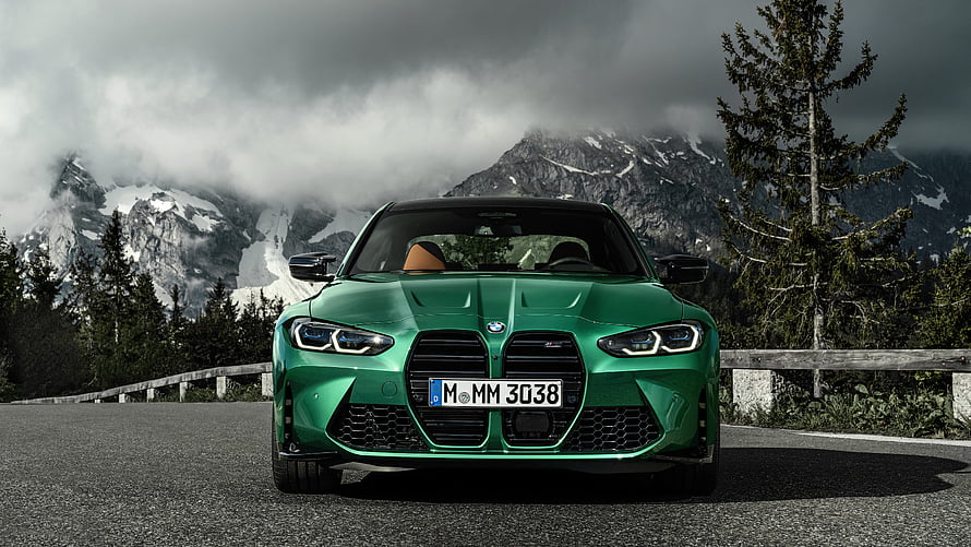 Green BMW M3 Competition Coupe Parked on Mountain Road with Snowy Peaks HD wallpaper