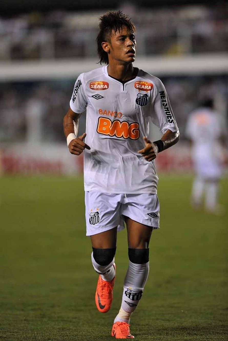 Neymar in Santos FC white home kit running on the pitch with orange boots HD phone wallpaper