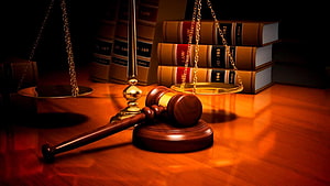Wooden Gavel and Scales of Justice on a Desk with Law Books HD wallpaper