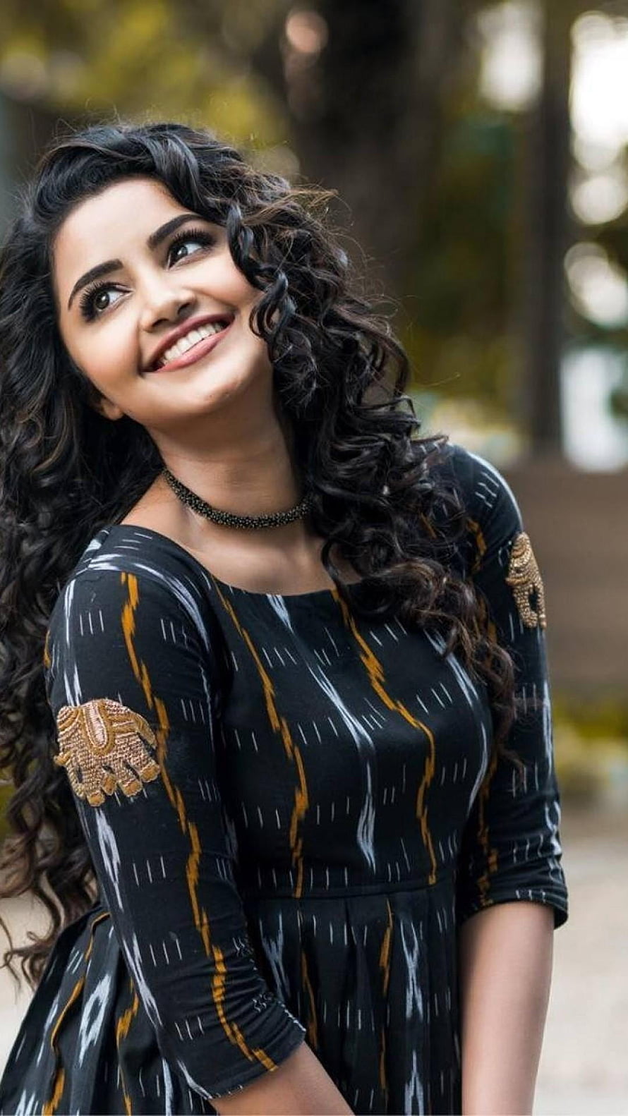 Sai Pallavi smiling portrait wearing a black patterned dress with gold embroidery HD phone wallpaper