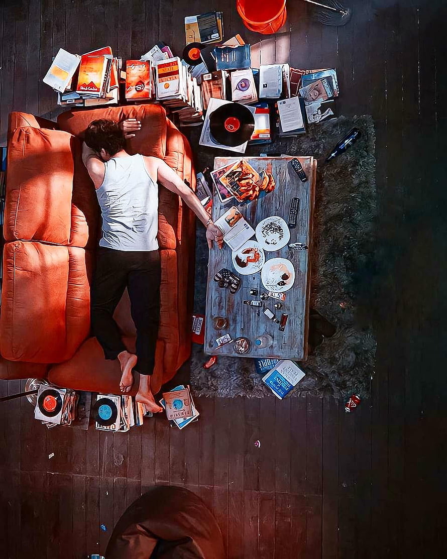 Overhead View of Man Sleeping on Orange Sofa Amidst Messy Room with Vinyl Records and Trash, Trending of Master movie Thalapathy Vijay sleeping, master thalapathy HD phone wallpaper