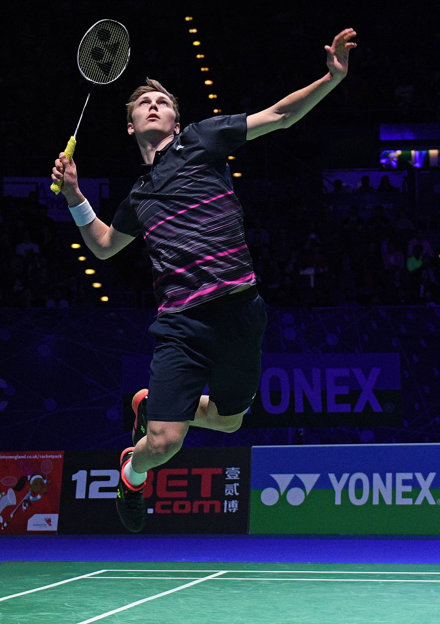 Viktor Axelsen mid-air smash during a professional badminton tournament match HD phone wallpaper
