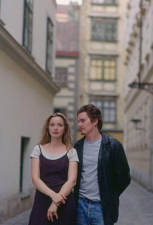 Before Sunrise film still of a couple walking through a narrow European alleyway HD phone wallpaper