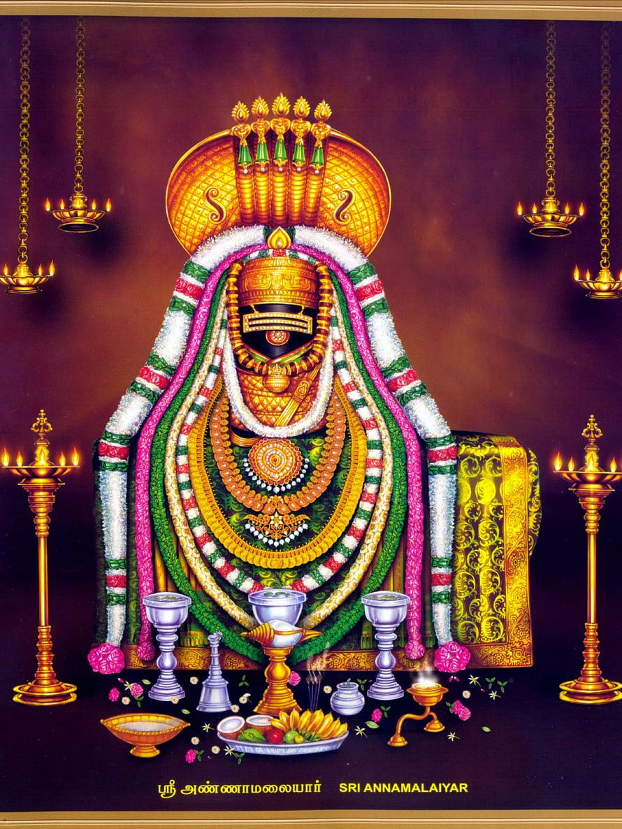 Sri Annamalaiyar deity adorned with garlands and temple oil lamps HD phone wallpaper