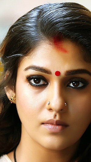 Nayanthara Close-Up Portrait With Traditional Red Bindis And Gold Earrings HD phone wallpaper