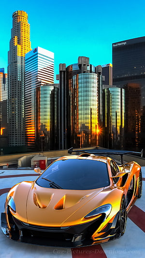 Golden McLaren P1 GTR Hypercar on Rooftop with City Skyline at Sunset HD phone wallpaper