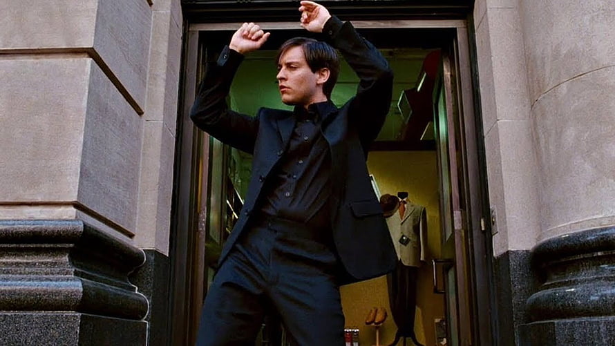 Eddie Murphy in black suit striking a pose in doorway from the movie Coming to America HD wallpaper