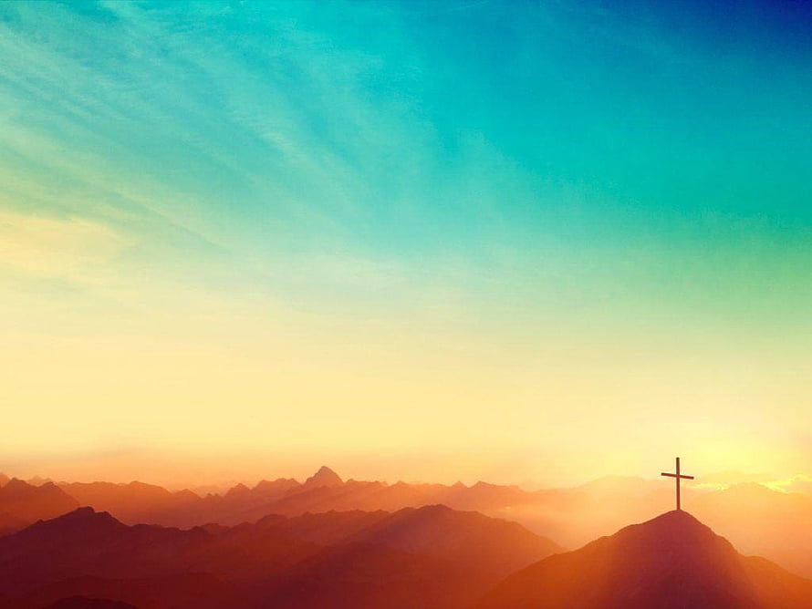 Silhouette of a Christian Cross on a Mountain Peak at Sunset HD wallpaper