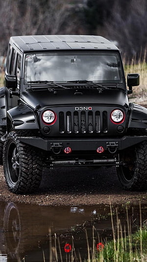 Black Jeep Wrangler Off-Road SUV with Red Accents in Muddy Terrain HD phone wallpaper