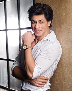 Shah Rukh Khan in a white shirt posing confidently with a wristwatch HD phone wallpaper