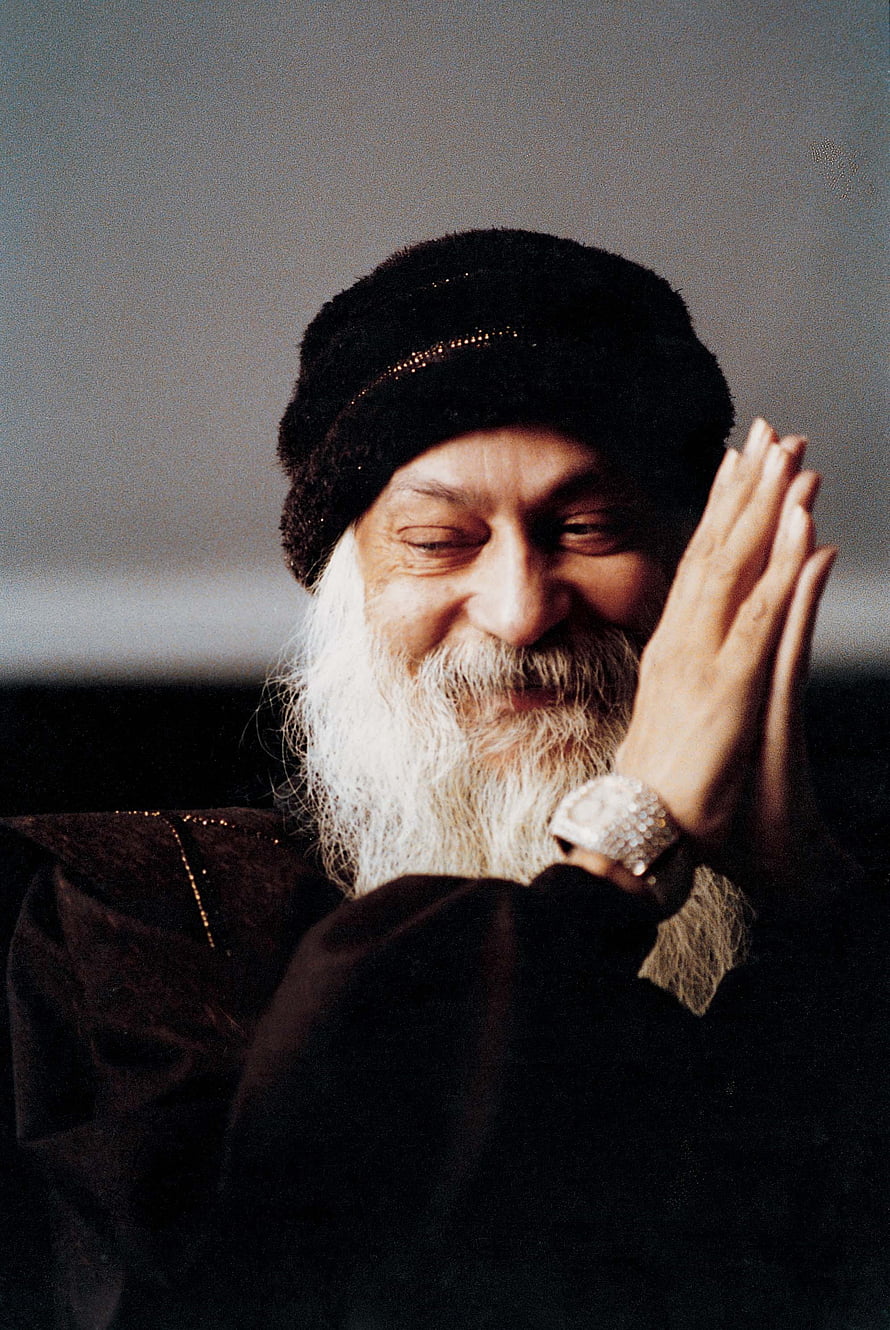 Portrait of Sadhguru with white beard and black hat smiling with hands in prayer HD phone wallpaper