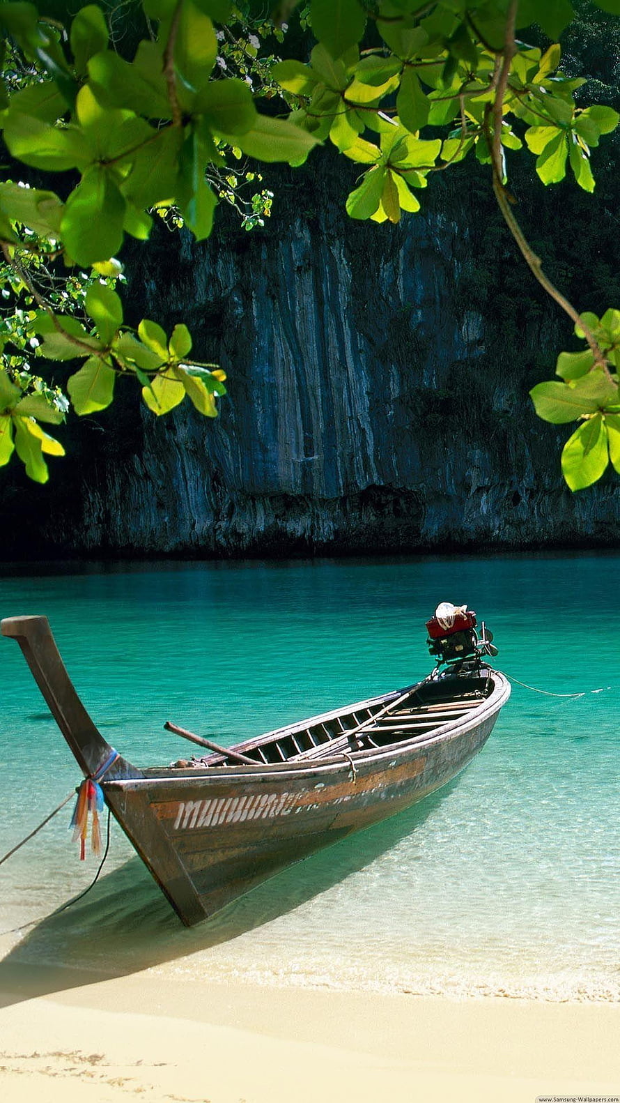 Traditional Thai Longtail Boat Anchored in Turquoise Tropical Lagoon HD phone wallpaper