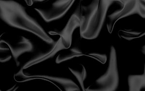 Elegant Black Silk Fabric Texture with Flowing Waves and Soft Satin Sheen HD wallpaper