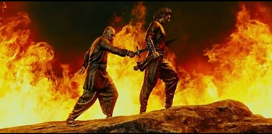 Bahubali and Kattappa Confrontation Scene Amidst Flames HD wallpaper