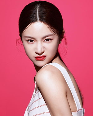 Go Yoon Jung Studio Portrait in White Striped Top Against Vibrant Pink Background HD phone wallpaper