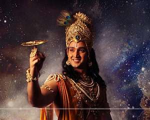 Lord Krishna Holding Sudarshana Chakra in Golden Crown and Traditional Attire HD wallpaper