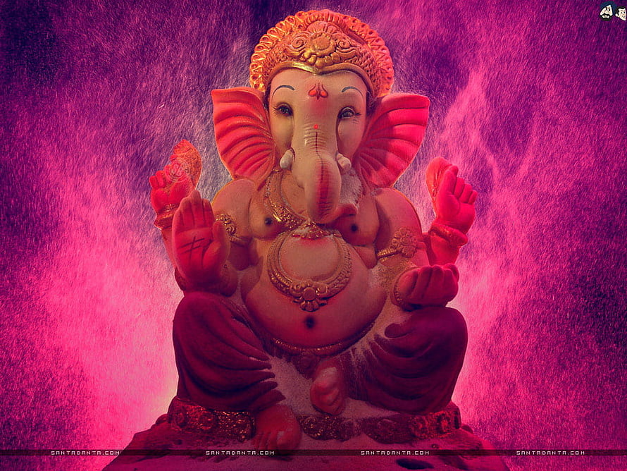 Lord Ganesha Seated Statue with Golden Crown and Ornate Jewelry Against Vibrant Pink Background HD wallpaper