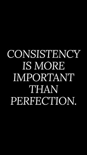 Minimalist Black Background with White Serif Typography Quote on Consistency and Perfection HD phone wallpaper