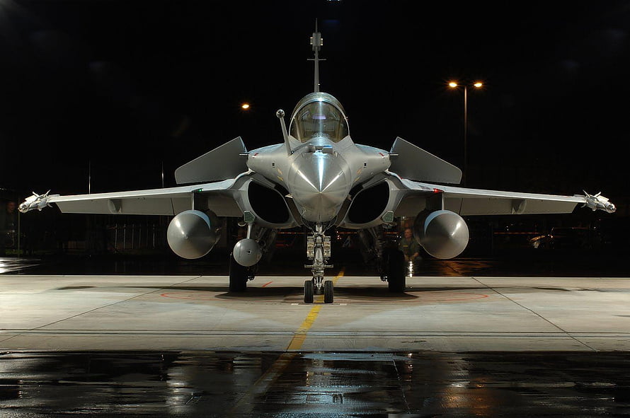 Indian Air Force Rafale Fighter Jet Parked on Wet Tarmac at Night HD wallpaper