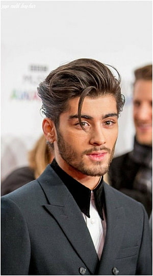 Zayn Malik in a dark suit with styled long hair and a trimmed beard at a formal event HD phone wallpaper