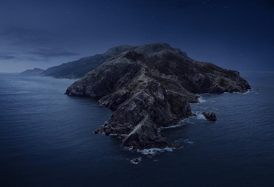 Mystical Rocky Island at Night Under a Starry Sky HD wallpaper
