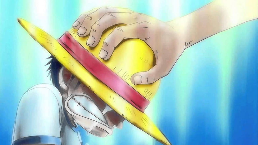 One Piece Anime Scene: Hand Placing Straw Hat on Crying Character HD wallpaper