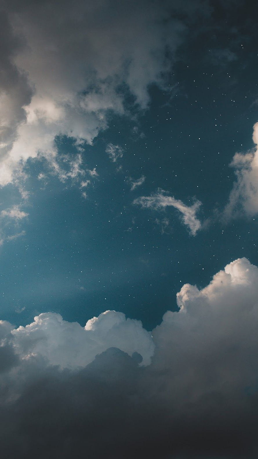 Starry Night Sky With Fluffy Clouds And Deep Blue Atmosphere HD phone wallpaper