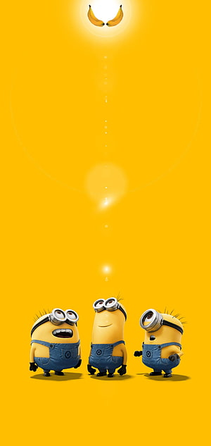 Three Minions Looking Up at Glowing Bananas on Bright Yellow Background HD phone wallpaper