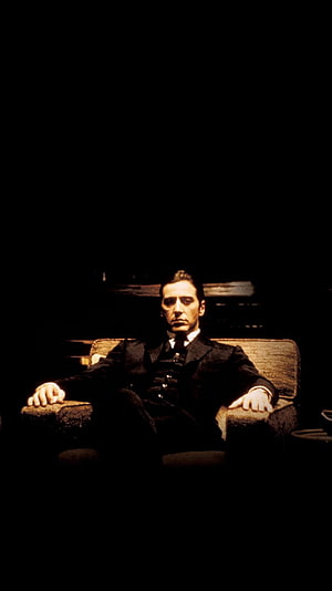Vito Corleone in The Godfather Part II seated in a dark room HD phone wallpaper