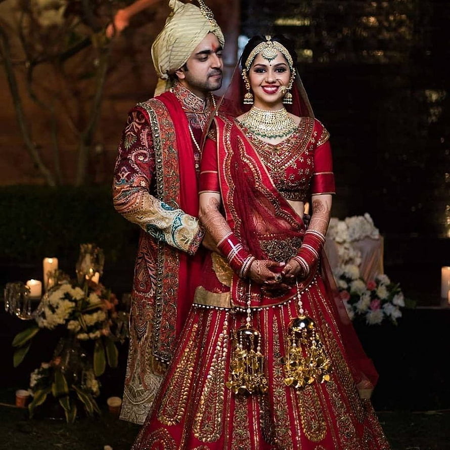 Indian Bride and Groom in Traditional Red Wedding Attire with Gold Jewelry HD phone wallpaper