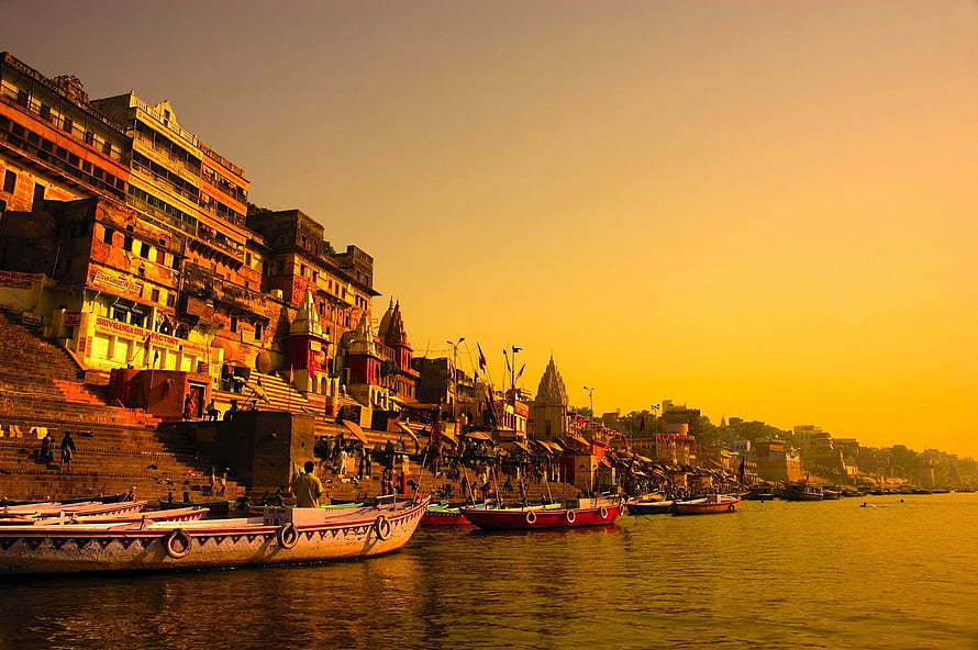 Varanasi Ghats and Boats Along the Ganges River at Golden Hour HD wallpaper
