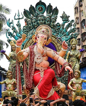 Grand Ganesha Idol with Multi-Headed Serpent Canopy and Divine Attendants HD phone wallpaper