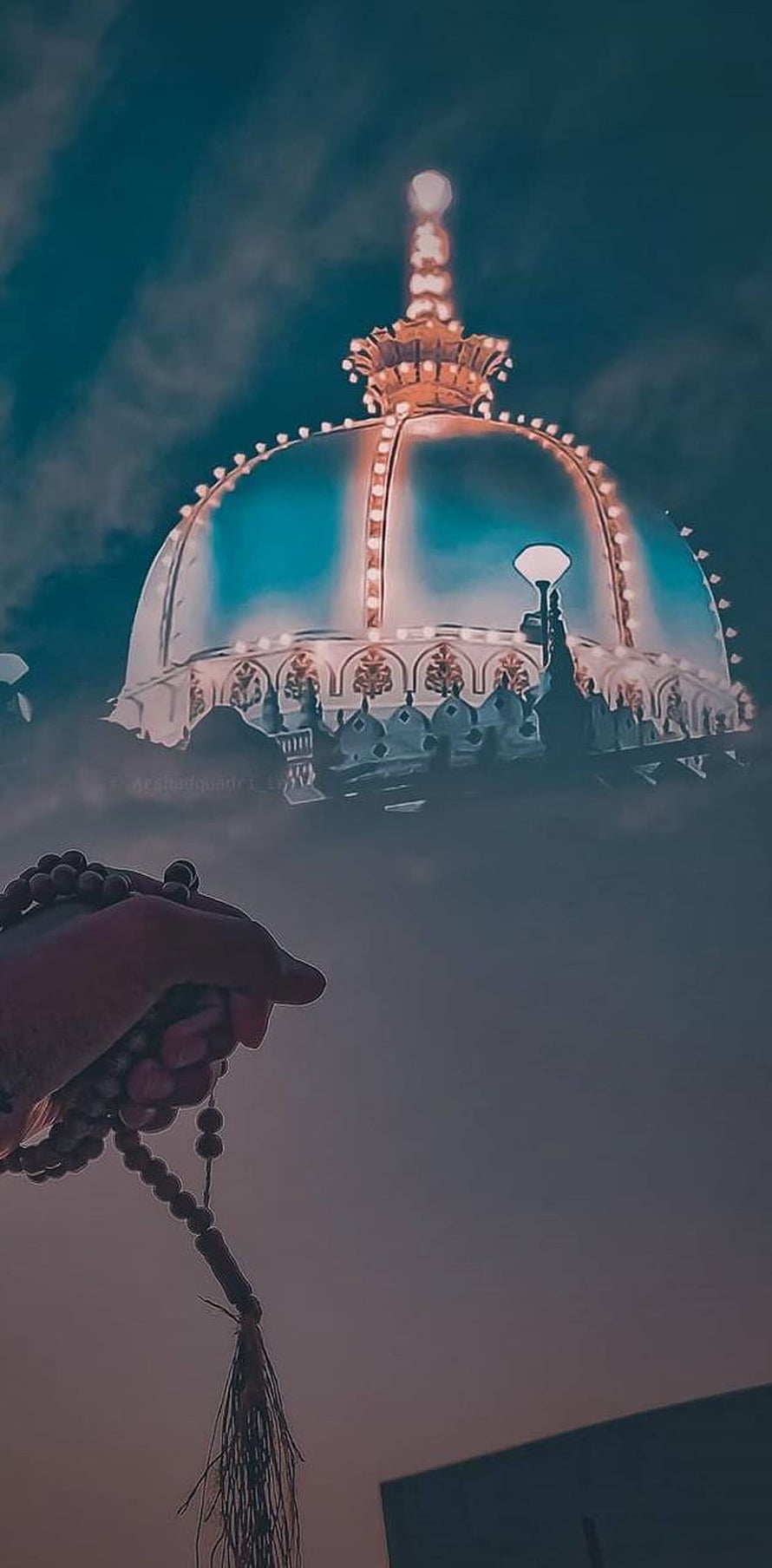 Hand Holding Prayer Beads in Front of Illuminated Mosque Dome at Night HD phone wallpaper