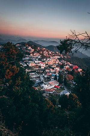Mussoorie Hill Station at Dusk with Misty Mountain Ranges and Scattered Cottages HD phone wallpaper