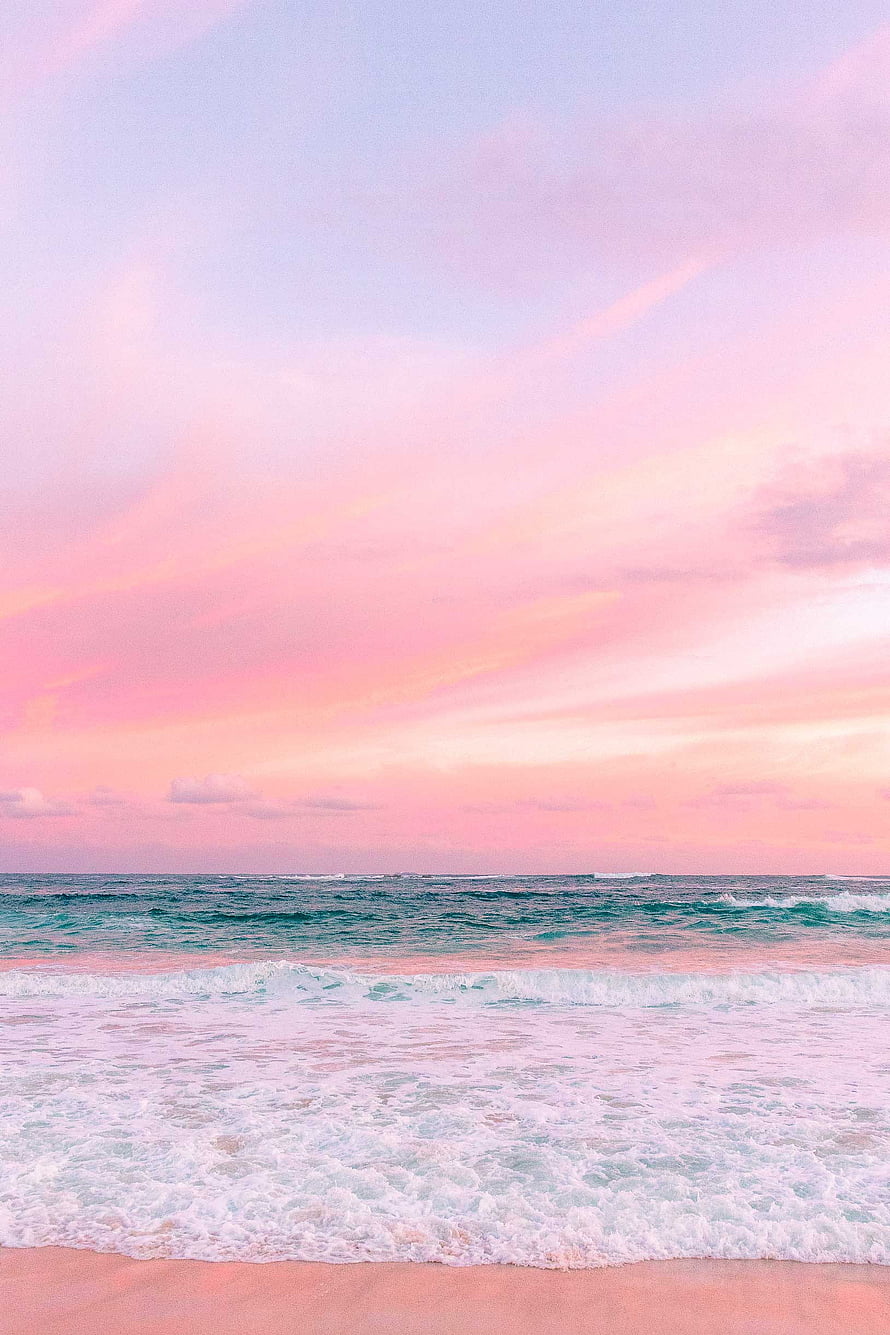 Pastel Pink Beach Sunset with Gentle Waves and Soft Ocean Horizon HD phone wallpaper