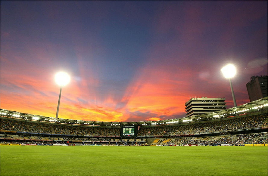 Stadium at Sunset with Vibrant Orange and Purple Sky HD wallpaper