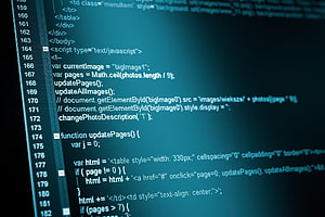 Close-up of JavaScript and HTML source code displayed in a dark-themed editor HD wallpaper