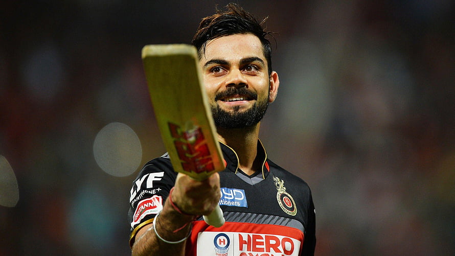 Virat Kohli in Royal Challengers Bangalore Jersey Holding Cricket Bat HD wallpaper