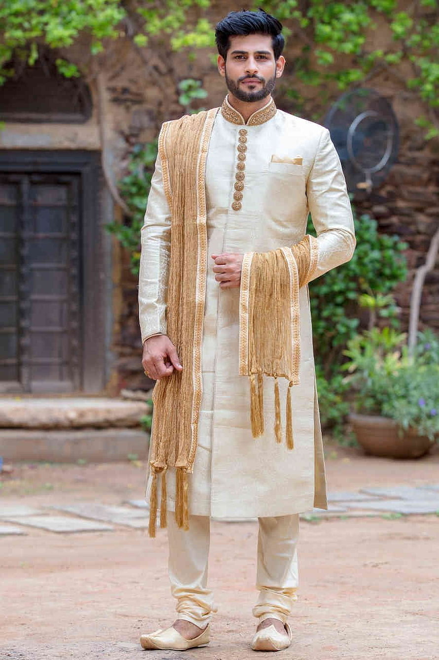 Elegant Cream Sherwani With Gold Embroidery And Tasseled Stole For Men HD phone wallpaper