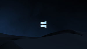 Windows 10 Logo Floating Over Dark Desert Dunes at Night HD wallpaper