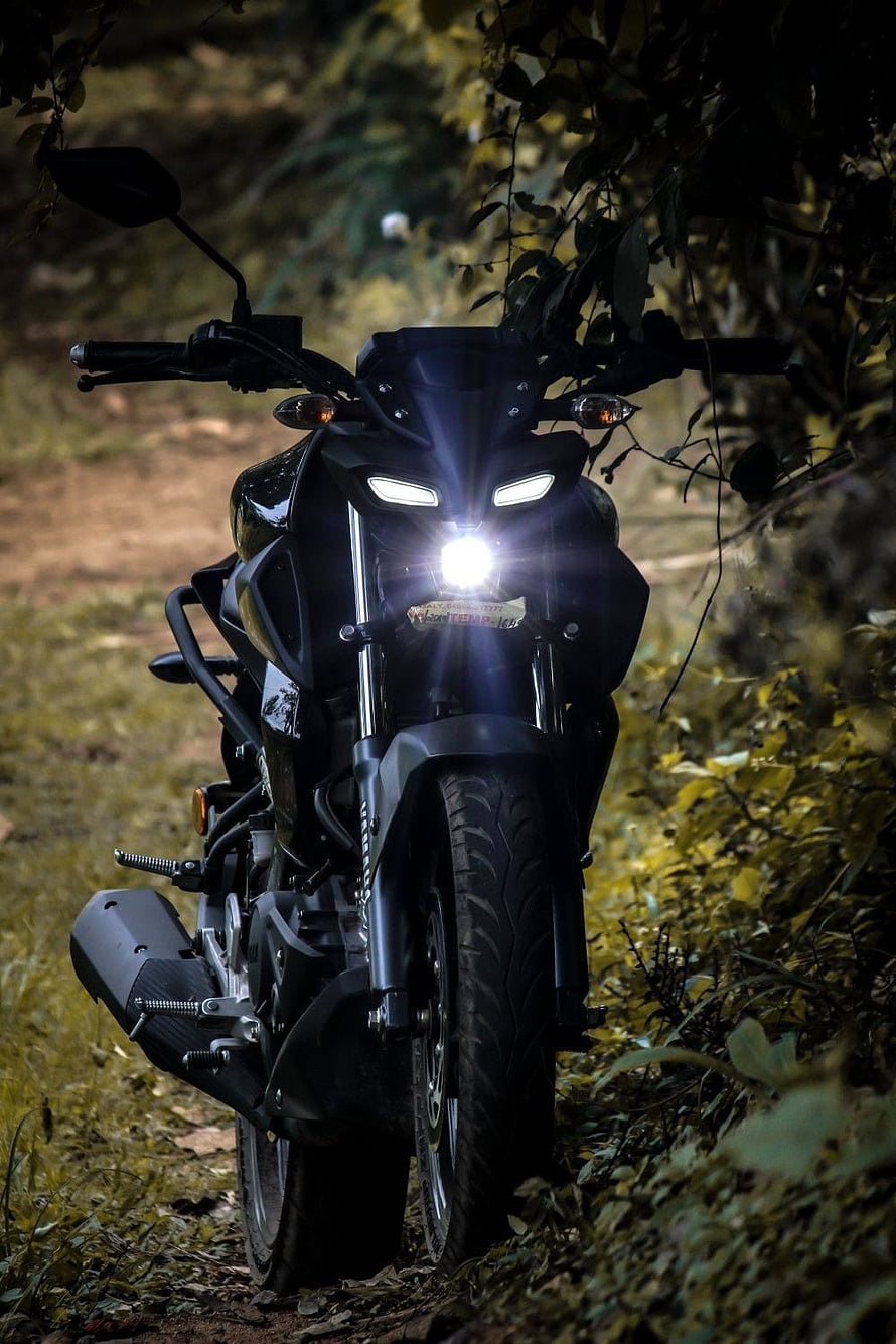 Black Bajaj Pulsar NS200 Motorcycle with LED Headlights on Forest Trail HD phone wallpaper