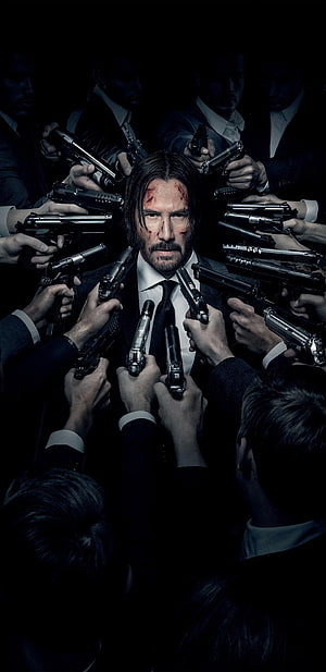 John Wick Surrounded by Guns in Dark Suit HD phone wallpaper
