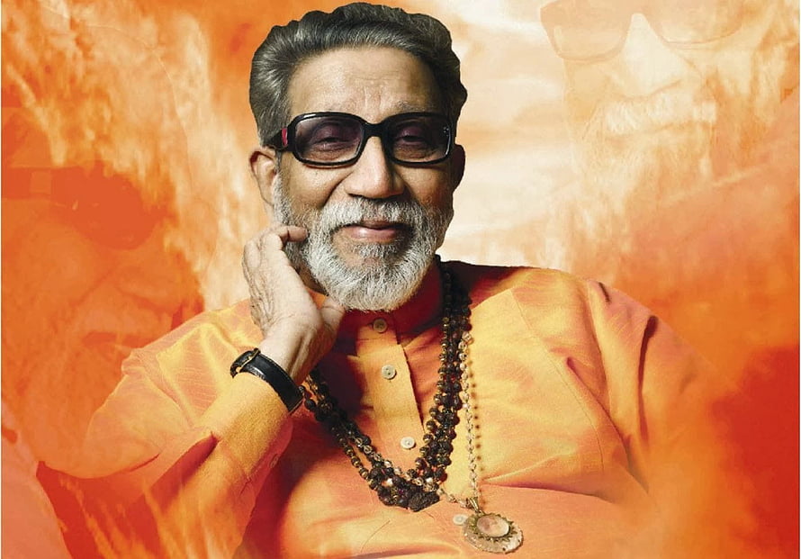 Portrait of Indian Music Legend Bappi Lahiri Wearing Orange Kurta and Sunglasses HD wallpaper