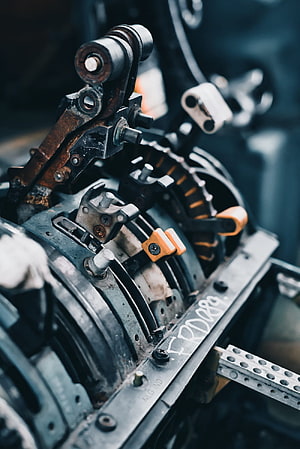 Close-Up of Industrial Mechanical Assembly with Gears and Linkages HD phone wallpaper