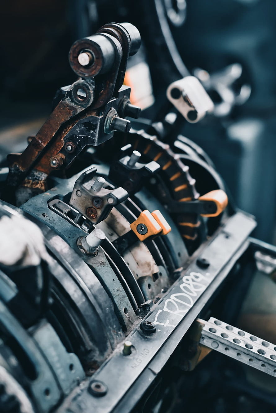 Close-Up of Industrial Mechanical Assembly with Gears and Linkages HD phone wallpaper
