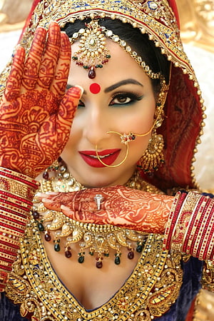Indian Bride in Traditional Blue Lehenga with Intricate Henna and Gold Jewelry HD phone wallpaper