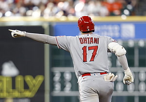 Shohei Ohtani in Los Angeles Angels uniform pointing during a baseball game HD wallpaper