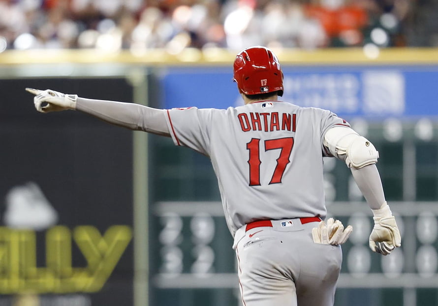 Shohei Ohtani in Los Angeles Angels uniform pointing during a baseball game HD wallpaper
