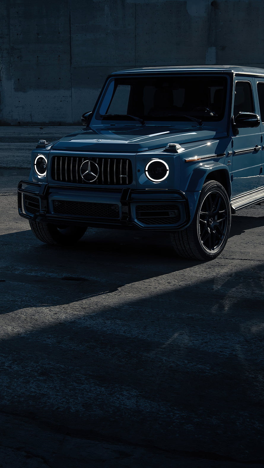 Mercedes-Benz G63 AMG SUV in Dark Blue with Circular LED Headlights and Black Alloy Wheels HD phone wallpaper